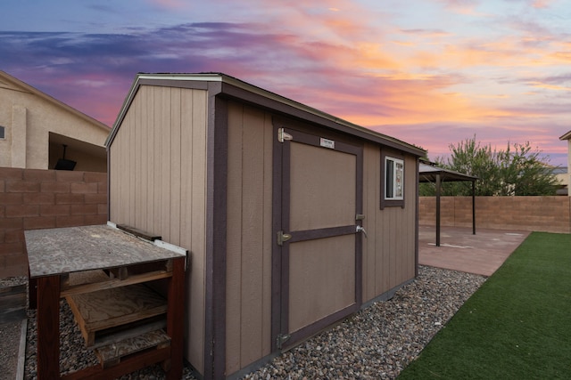 view of outdoor structure at dusk