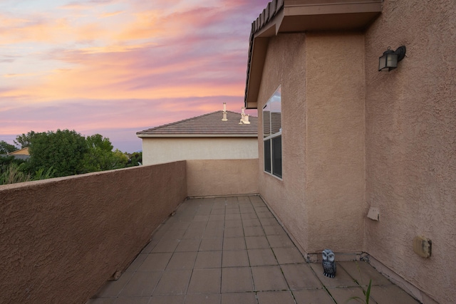 view of patio terrace at dusk