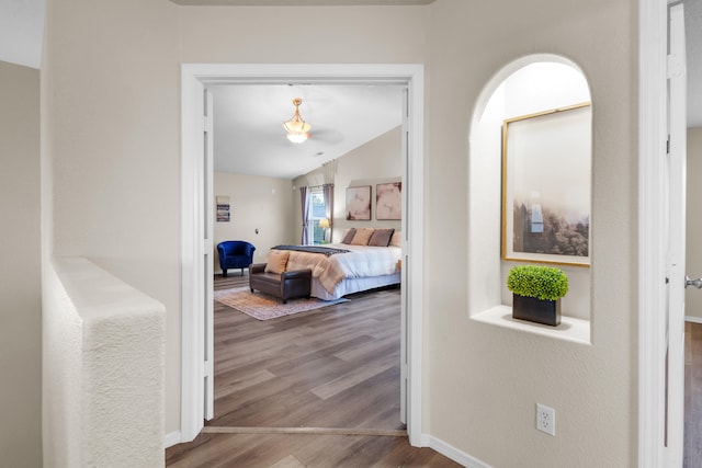 bedroom featuring lofted ceiling and wood-type flooring