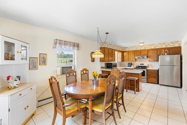 dining room featuring cooling unit, baseboard heating, and light tile patterned floors