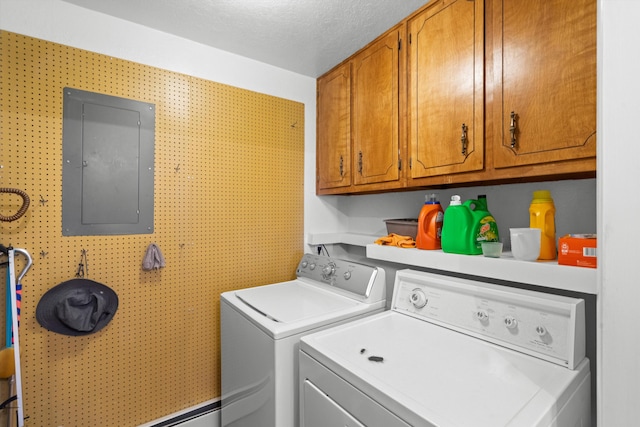 laundry area featuring cabinets, a textured ceiling, electric panel, and washer and dryer