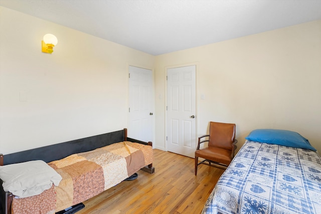 bedroom with hardwood / wood-style floors