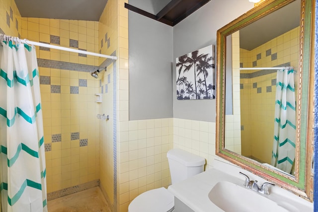 bathroom with vanity, tile walls, toilet, and a shower with shower curtain