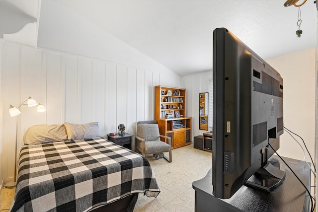 bedroom featuring lofted ceiling