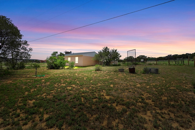 view of yard at dusk