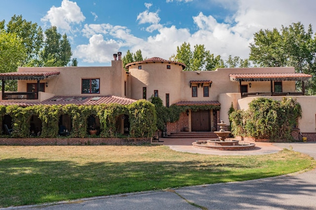 view of front of house with a front lawn