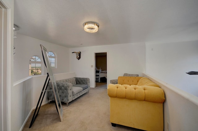 carpeted living room with a textured ceiling