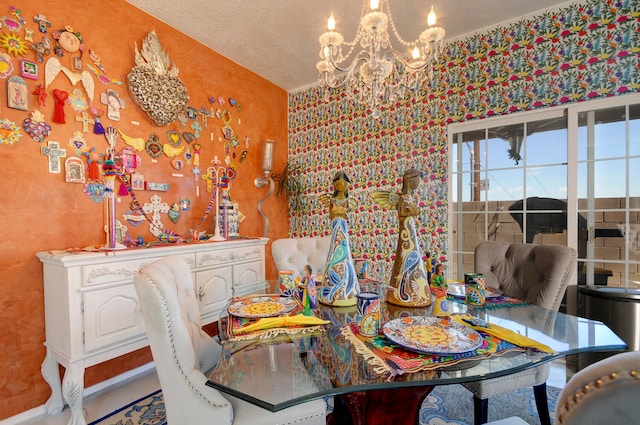 dining room with a notable chandelier and a textured ceiling