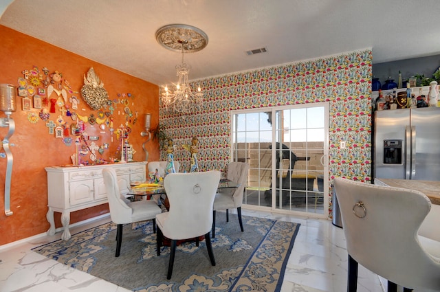 dining area with a notable chandelier