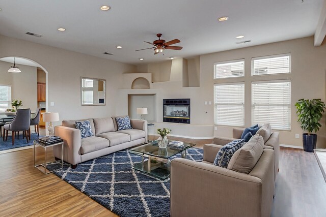 living room with ceiling fan and hardwood / wood-style floors