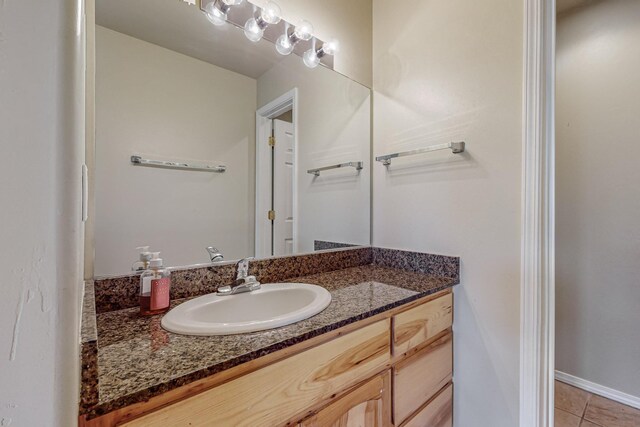 bathroom with vanity and tile patterned flooring