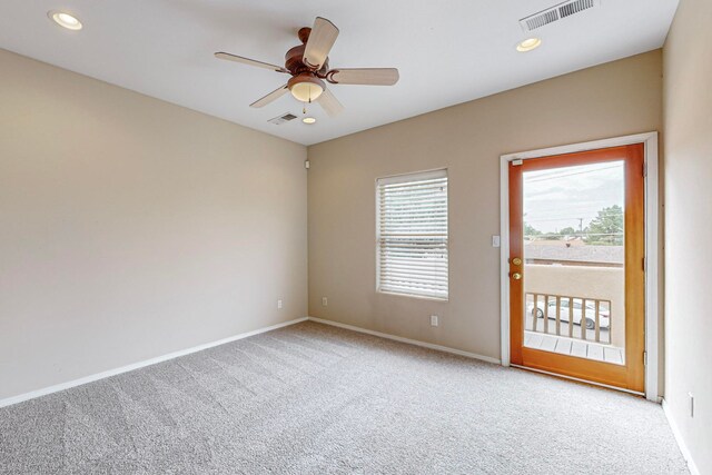 carpeted empty room with ceiling fan