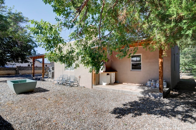 back of house with a patio