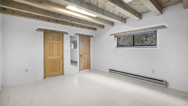 basement with a baseboard radiator and wood ceiling