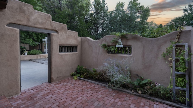 view of patio terrace at dusk