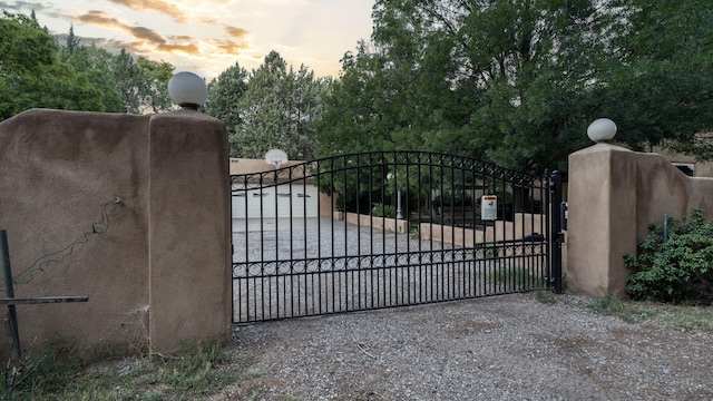 view of gate at dusk