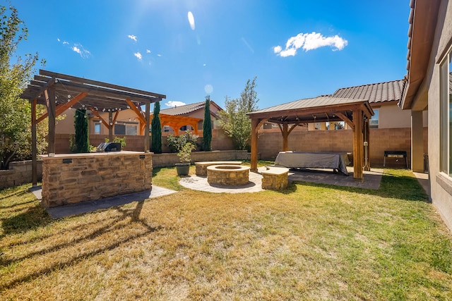 view of yard featuring an outdoor living space with a fire pit, a gazebo, a pergola, and a patio