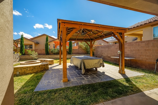 view of patio / terrace with a fire pit and a gazebo