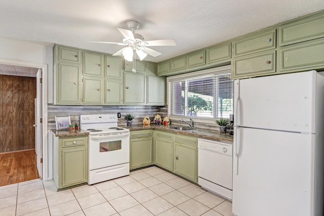 kitchen with ceiling fan, white appliances, light tile patterned flooring, green cabinetry, and sink