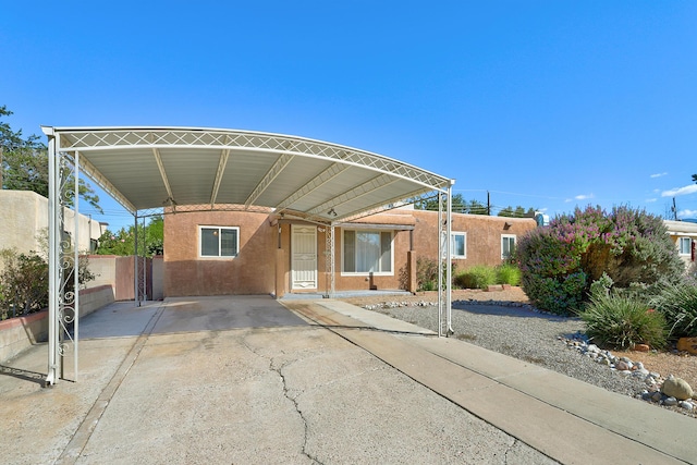 view of vehicle parking with a carport