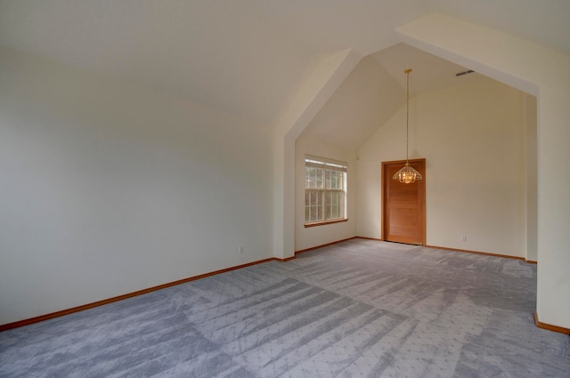 interior space with high vaulted ceiling and carpet floors