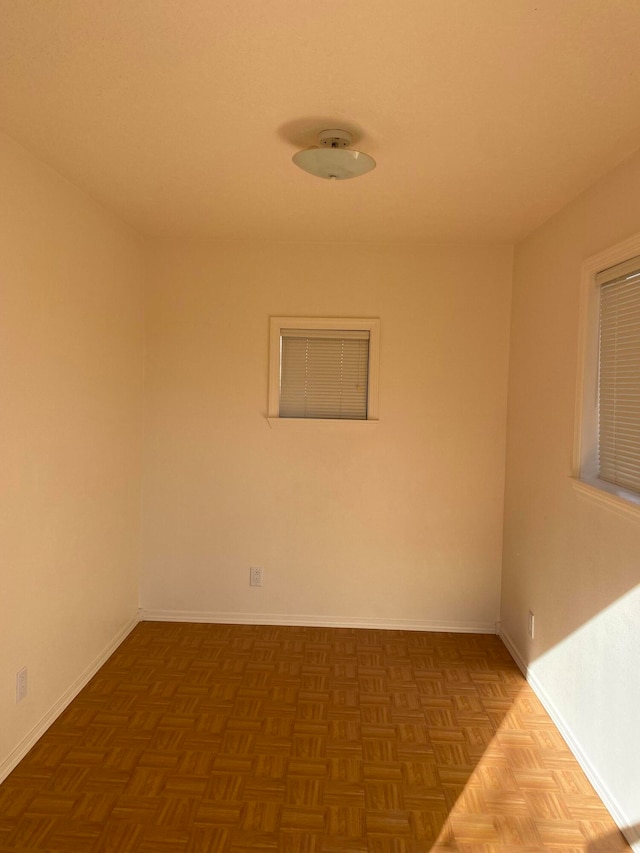 spare room with parquet flooring