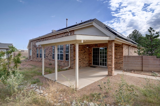 rear view of house featuring a patio