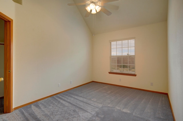 empty room featuring ceiling fan, carpet, and vaulted ceiling