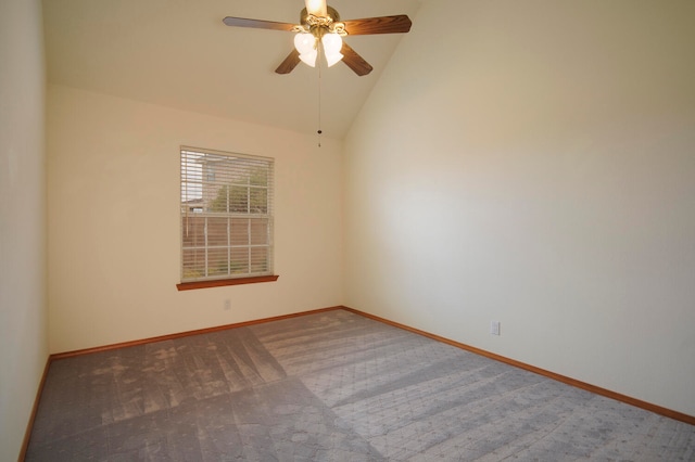 carpeted empty room with ceiling fan and high vaulted ceiling