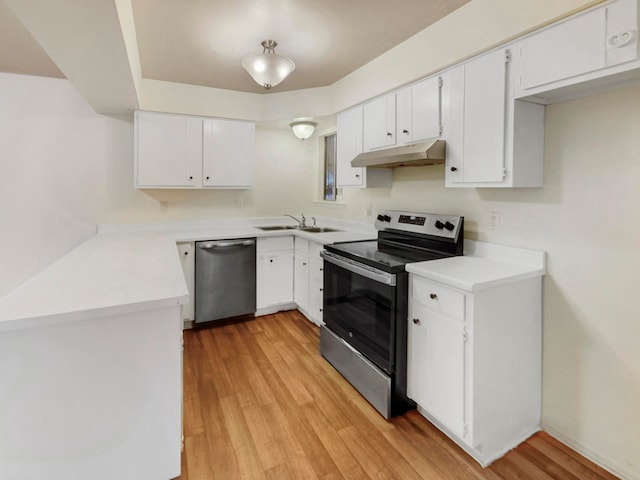 kitchen featuring light wood-type flooring, white cabinetry, sink, and appliances with stainless steel finishes