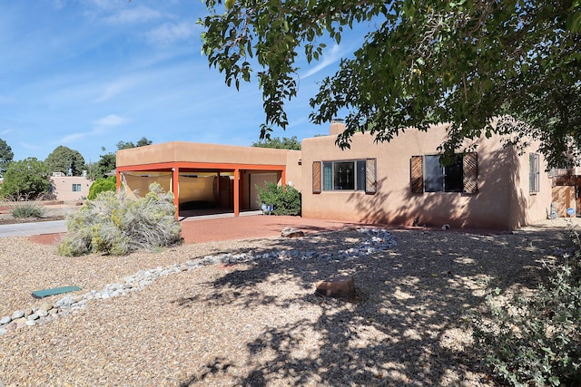 view of pueblo revival-style home