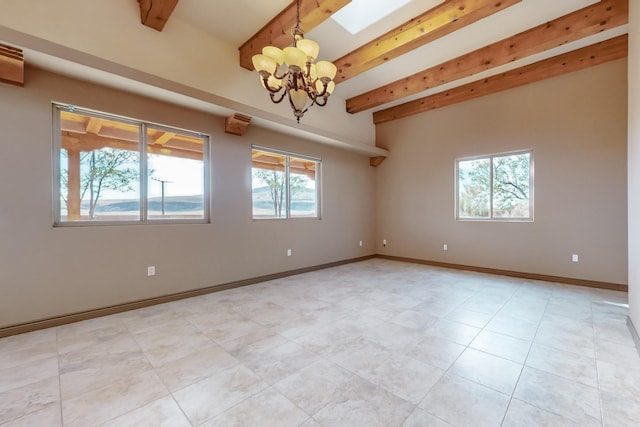 spare room featuring beamed ceiling and an inviting chandelier