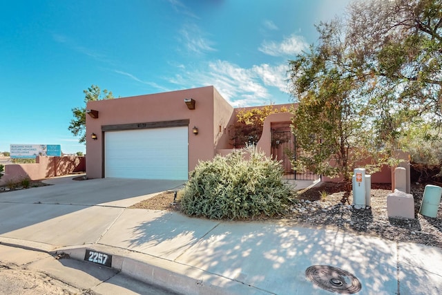 southwest-style home with a garage