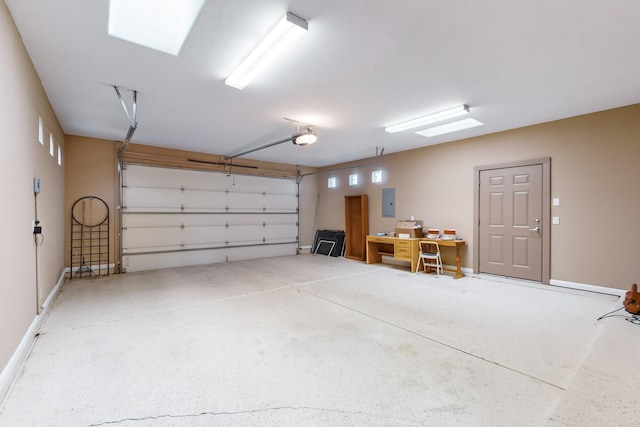 garage featuring electric panel and a garage door opener