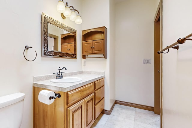 bathroom with vanity and toilet