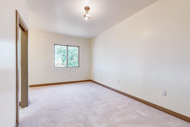 unfurnished bedroom featuring light carpet