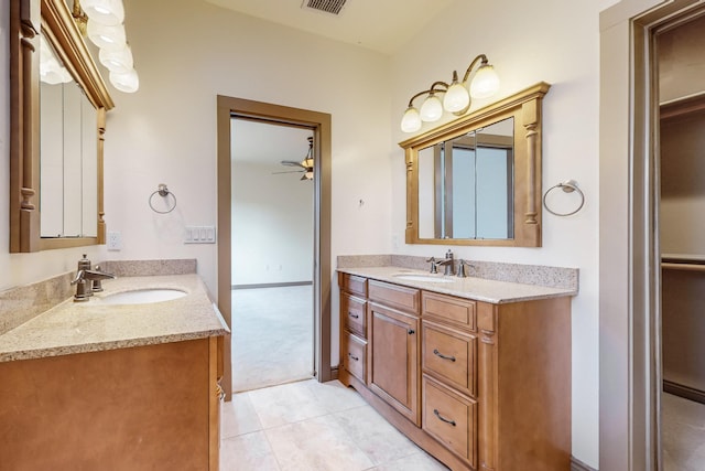 bathroom featuring tile patterned floors, vanity, and ceiling fan