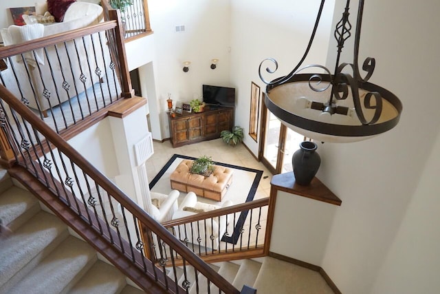 280 Angel Rd, Corrales, NM 87048 - stairs featuring a towering ceiling and tile patterned floors