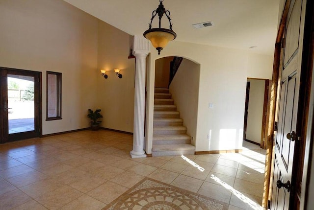 280 Angel Rd, Corrales, NM 87048 - entryway featuring light tile patterned floors, arched walkways, decorative columns, and stairway