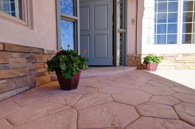 280 Angel Rd, Corrales, NM 87048 - property entrance with stone siding and stucco siding