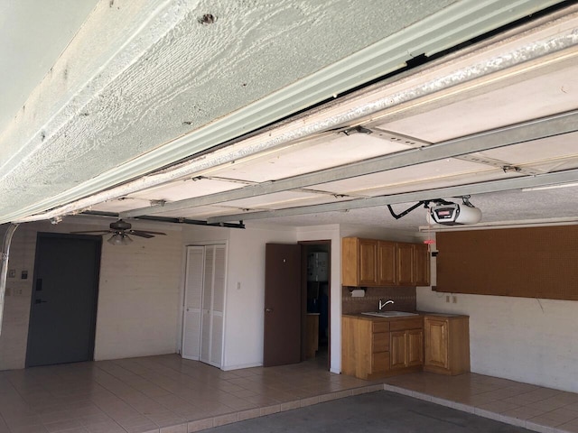 280 Angel Rd, Corrales, NM 87048 - garage featuring a garage door opener and a sink