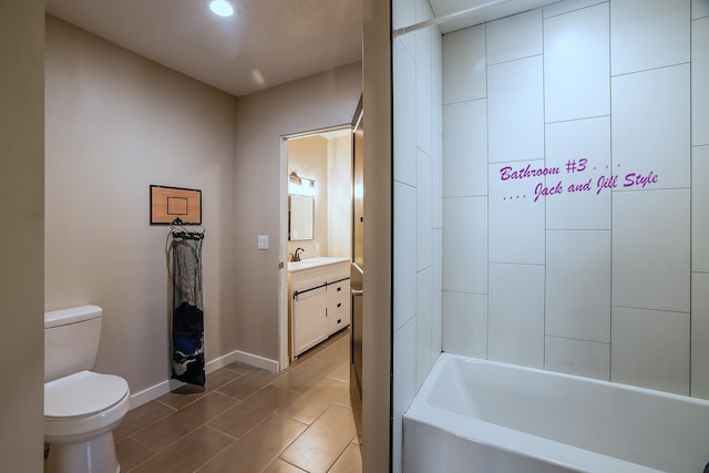 full bathroom with tile patterned floors, tiled shower / bath combo, vanity, and toilet