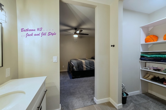 bathroom featuring vanity and ceiling fan