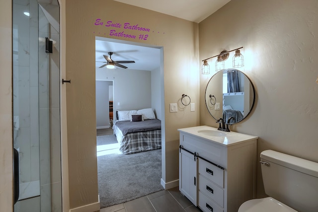 bathroom featuring tile patterned flooring, ceiling fan, vanity, and toilet