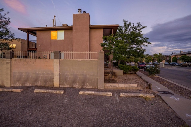 view of property exterior at dusk