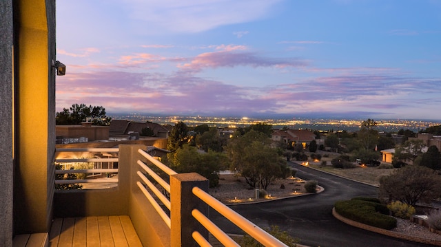 view of balcony at dusk