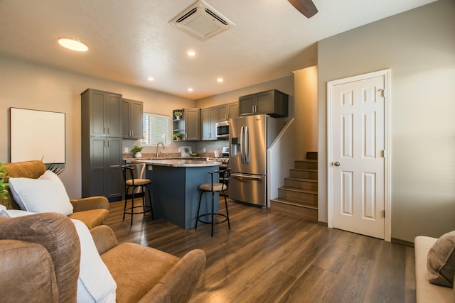 interior space featuring a textured ceiling, sink, and dark hardwood / wood-style flooring