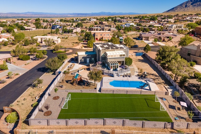 birds eye view of property featuring a mountain view