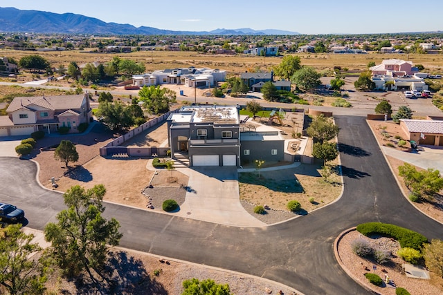 birds eye view of property with a mountain view