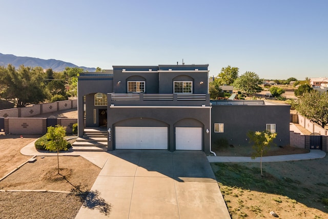 view of front facade featuring a mountain view and a garage